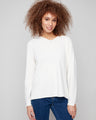 Ecru sweater with V neckline and plush texture, featuring side slits on sleeves for added style by Charlie B.