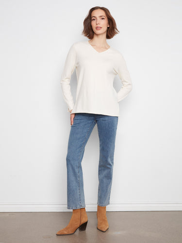 This stylish top features long sleeves, offering warmth and sophistication. Ideal for cooler days by Charlie B.
