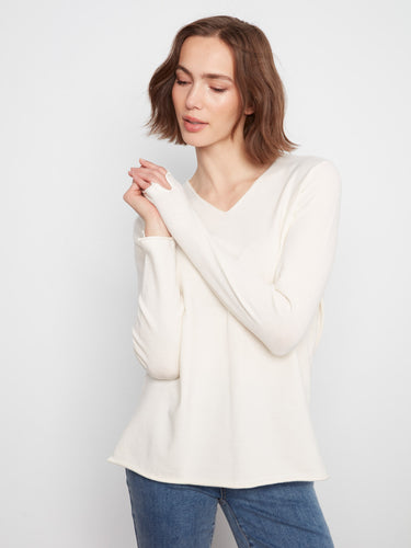 Relaxed fit knit top, providing ease of movement and a casual look. Pair with jeans or skirts effortlessly by Charlie B.