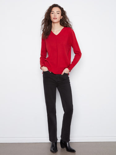 Soft knit fabric in this red top adds warmth and sophistication to your wardrobe. By Charlie B.