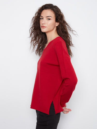 The versatile design of this red top complements various outfits effortlessly. By Charlie B.