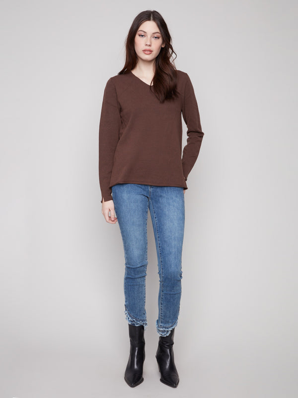 Elegant V-neckline sweater in heather mocha, featuring long sleeves and a timeless style by Charlie B.