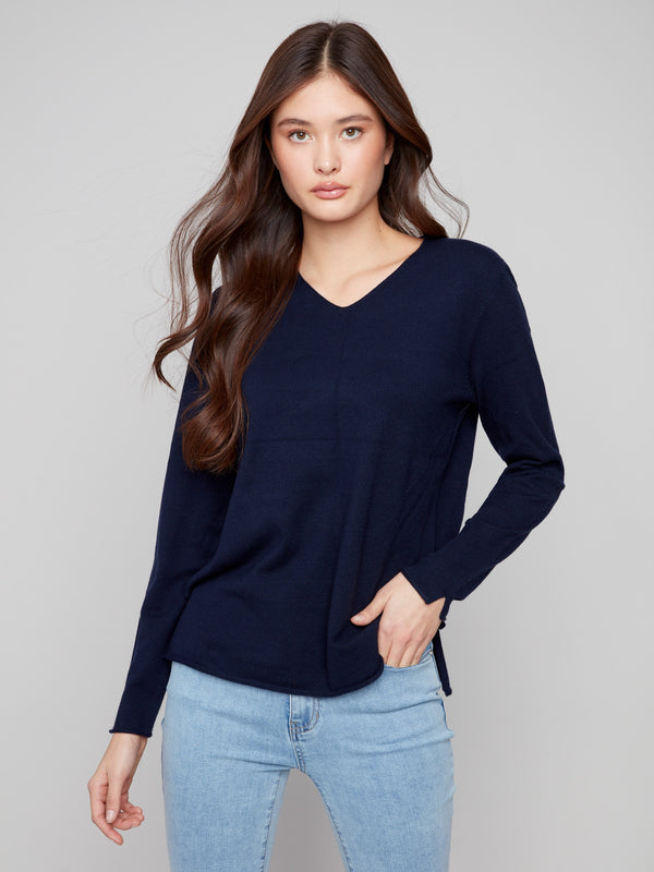 Navy sweater featuring a plush texture and V neckline, offering both comfort and style by Charlie B.