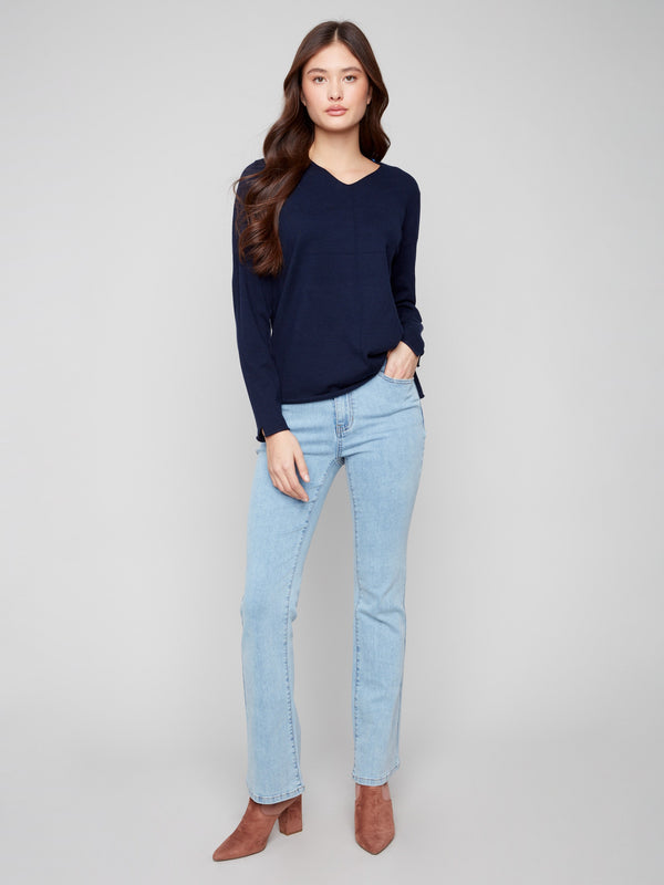 Elegant navy sweater with long sleeves, perfect for a classic look by Charlie B.