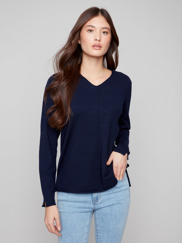 Chic navy V-neck sweater showcasing a timeless design with side slits on the hem by Charlie B.