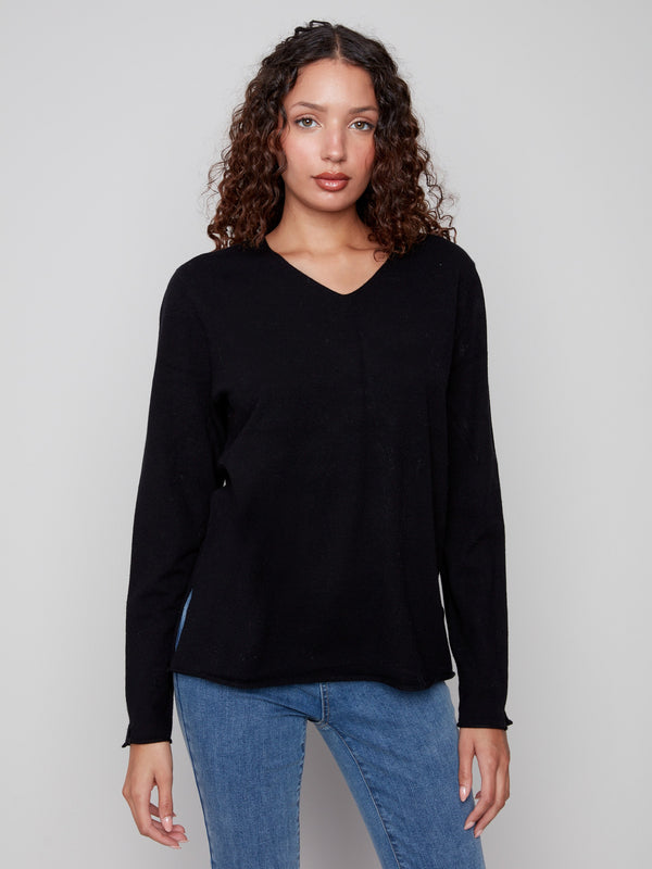 Elegant black sweater with a V neckline and plush texture, offering a timeless look by Charlie B.
