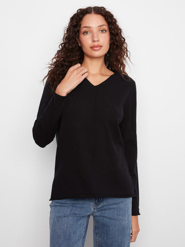 Elegant black V-neck sweater crafted from soft knit fabric for ultimate comfort by Charlie B.