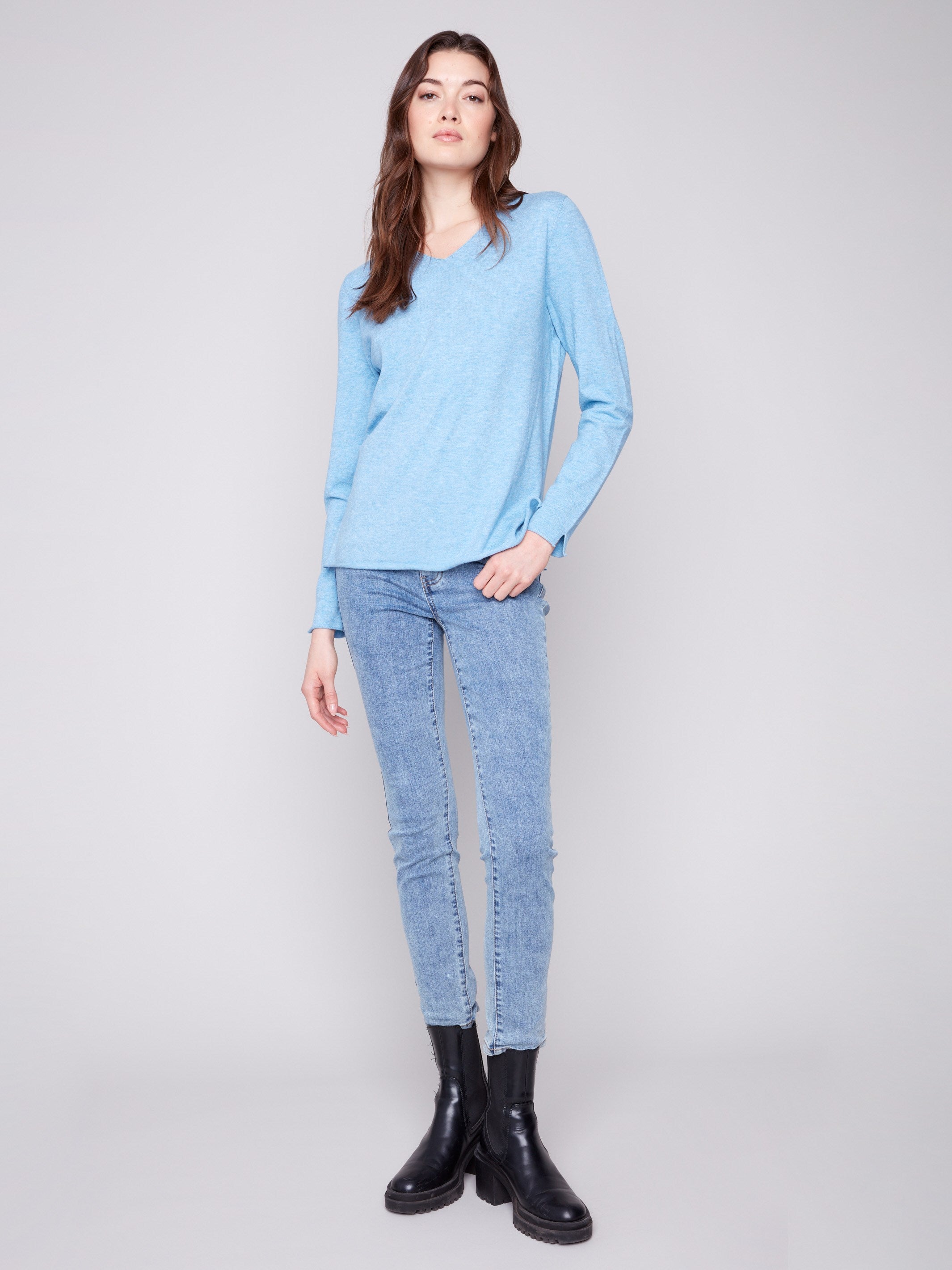 This stylish sweater features long sleeves designed for warmth and sophistication in cooler weather by Charlie B.