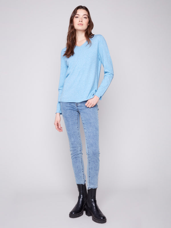 This stylish sweater features long sleeves designed for warmth and sophistication in cooler weather by Charlie B.