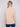 Long-sleeved sesame sweater with side slits on sleeves, combining practicality and elegance by Charlie B.