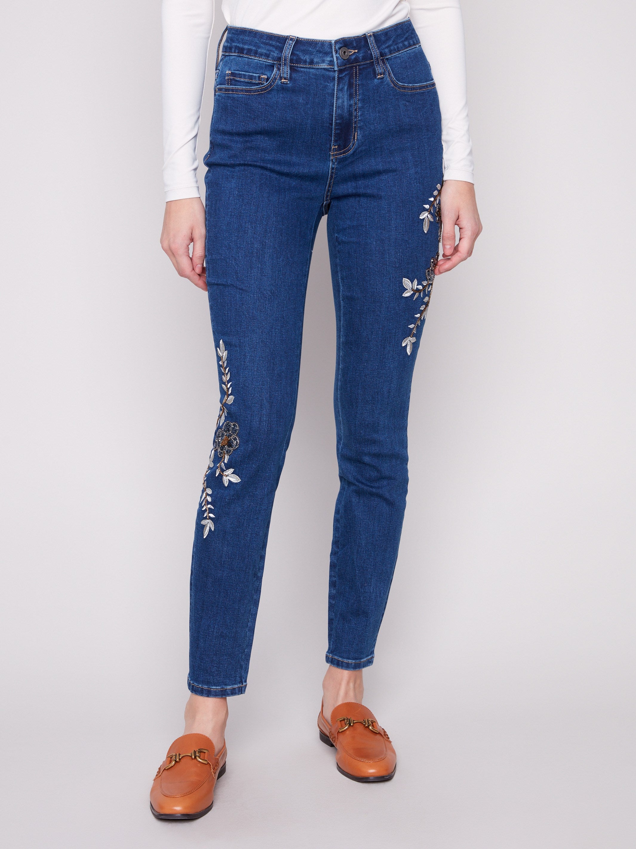 Stretch denim jeans featuring intricate beaded details along the legs for added elegance by Charlie B.