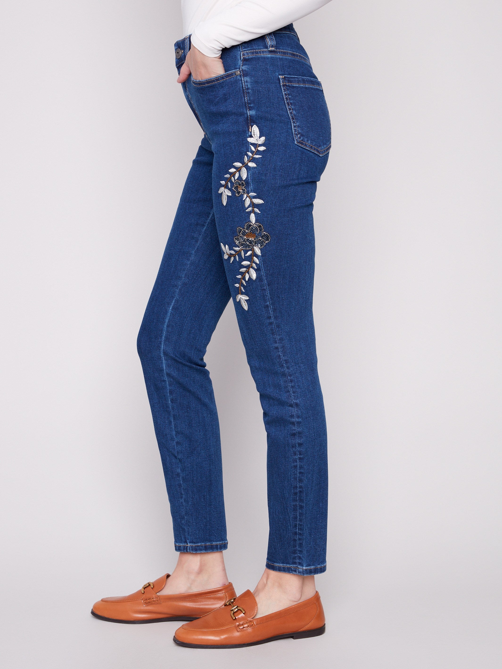 Long length indigo jeans with exquisite floral embroidery, combining style and comfort by Charlie B.