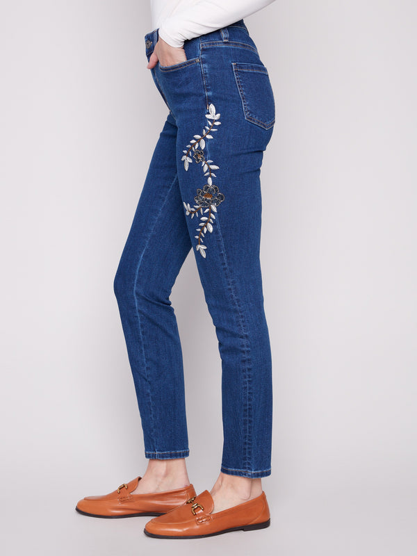 Long length indigo jeans with exquisite floral embroidery, combining style and comfort by Charlie B.
