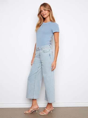 The belted design adds a touch of elegance to these versatile denim jeans by Charlie B.