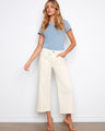 Natural-colored pants with a wide leg and cropped length, featuring a stylish belted design for versatile wear by Charlie B.