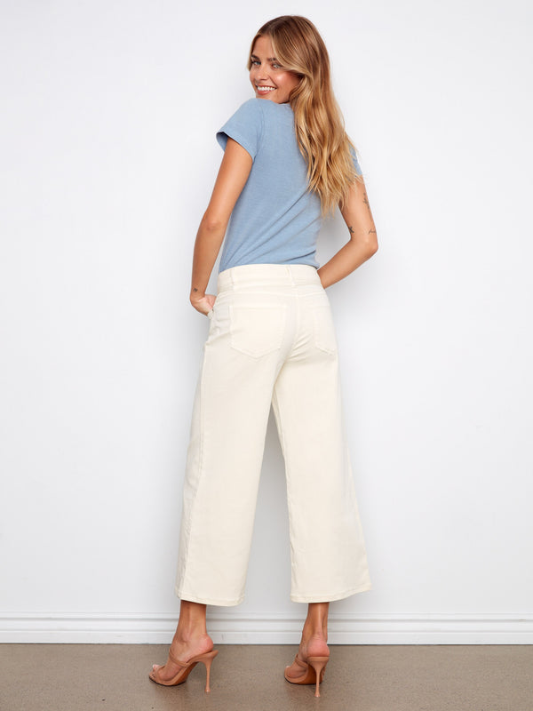 These natural-colored pants feature five functional pockets, combining practicality with style in a chic design by Charlie B.