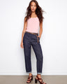 Denim pants with a slim fit and braided belt, showcasing adjustable cuffed hems for versatile styling by Charlie B.