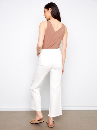 Chic white wide-leg pants made from stretch twill, designed with long length and classic five-pocket style by Charlie B.