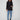 Black blazer featuring long sleeves with buttoned cuffs, tailored for a sleek look by Charlie B.