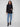 Black blazer featuring long sleeves with buttoned cuffs, tailored for a sleek look by Charlie B.