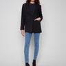 Black blazer featuring long sleeves with buttoned cuffs, tailored for a sleek look by Charlie B.