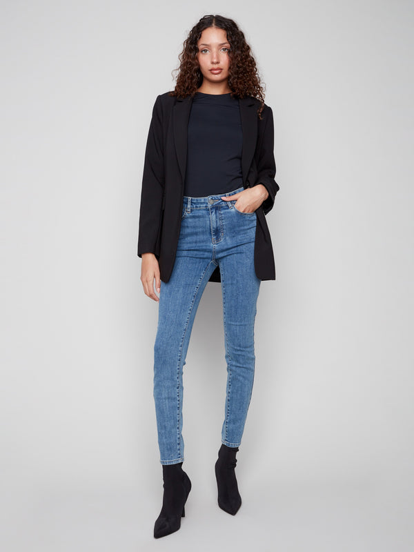 Stylish black blazer highlighting its modern single-button closure design by Charlie B.