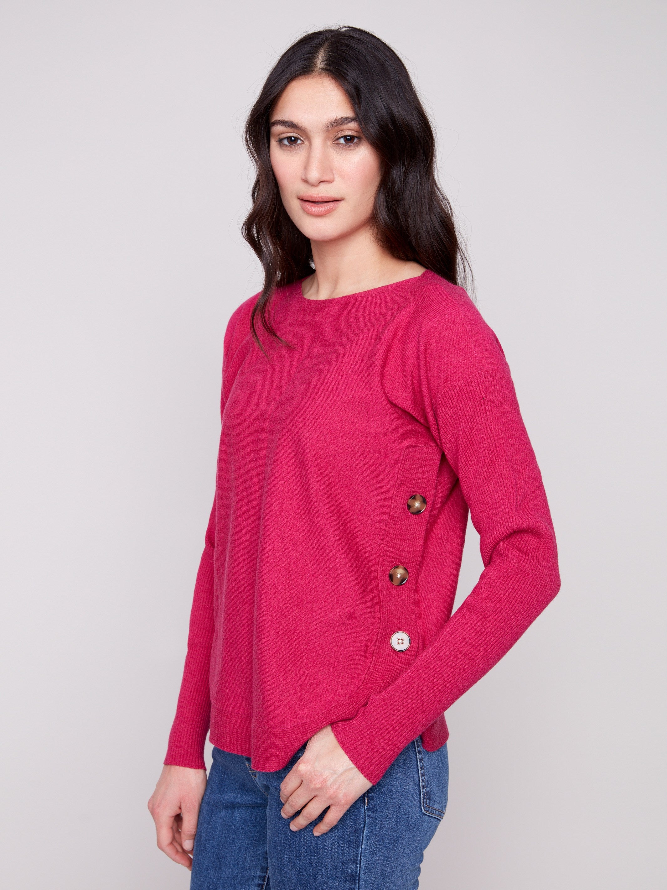 Heather hibiscus sweater with a stylish boat neck, ideal for layering in cooler weather. A versatile piece by Charlie B.