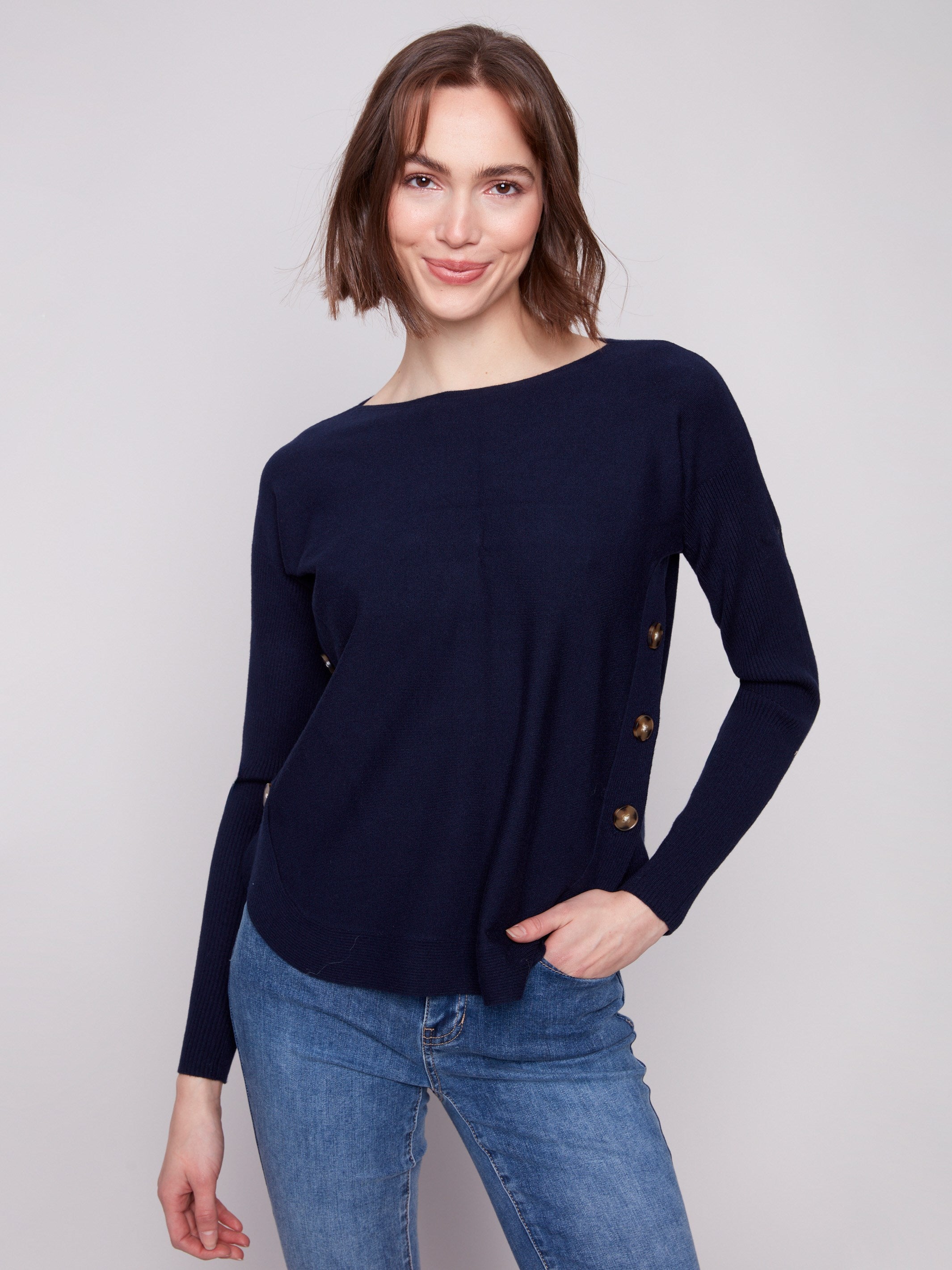 Navy sweater with a stylish boat neck design, ideal for adding a touch of elegance to your wardrobe by Charlie B.