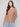 This truffle sweater has a rounded hem that offers a flattering silhouette for both casual and formal settings by Charlie B.
