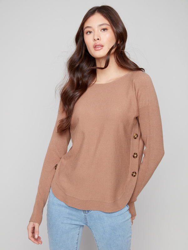 This truffle sweater has a rounded hem that offers a flattering silhouette for both casual and formal settings by Charlie B.