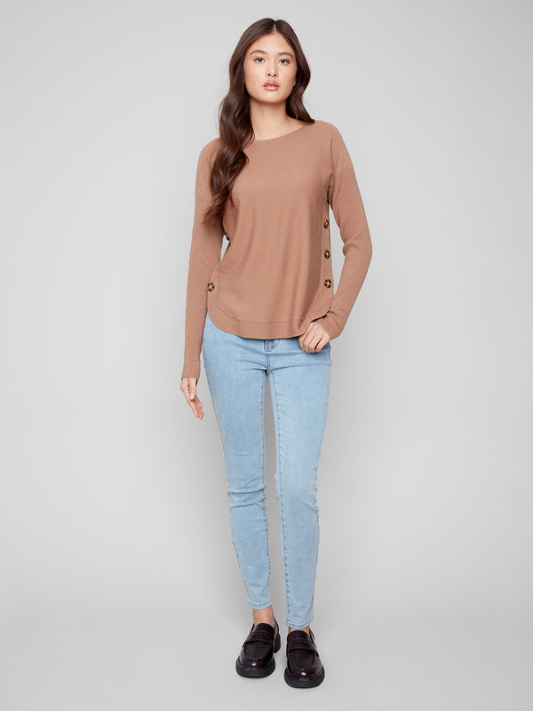 Classic truffle long-sleeve sweater designed with thoughtful details like side buttons and rounded hem for timeless appeal by Charlie B.