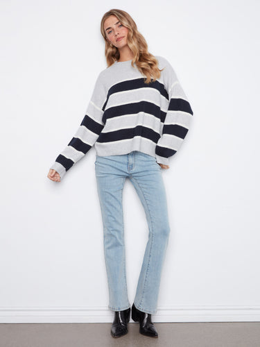 The yarn dyed striped pattern adds a trendy touch to this chic sweater. By Charlie B.