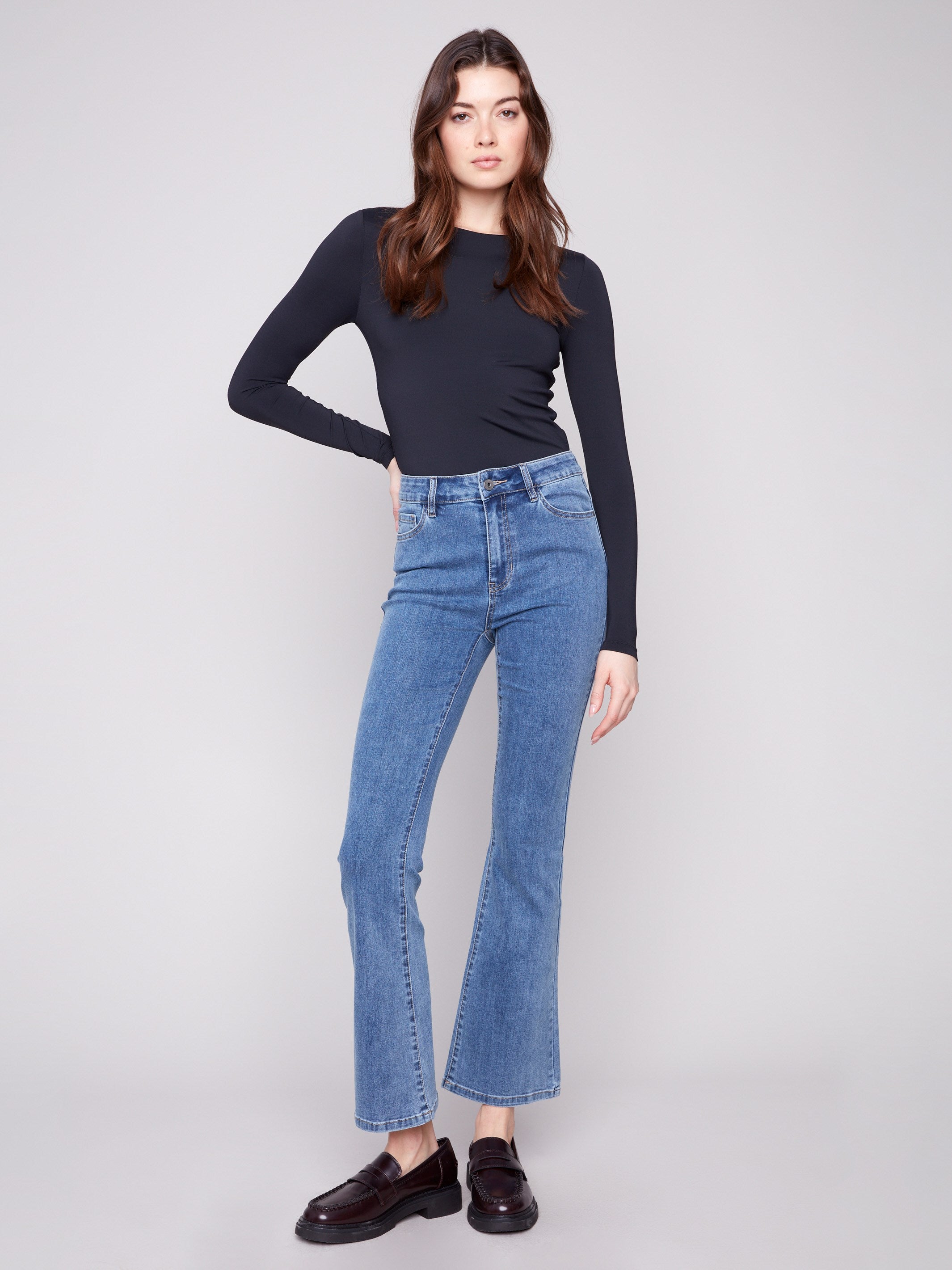 Medium blue bootcut jeans featuring a long length design, ideal for pairing with your favorite footwear by Charlie B.