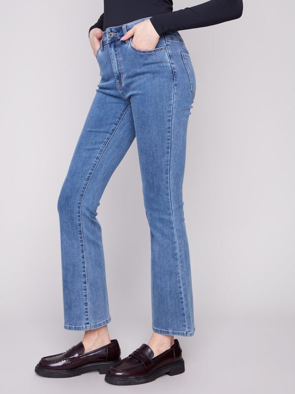 Showcasing a regular rise, these medium blue bootcut jeans provide a flattering fit for any occasion by Charlie B.