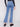 Designed with a five-pocket style, these medium blue bootcut jeans offer both functionality and style by Charlie B.