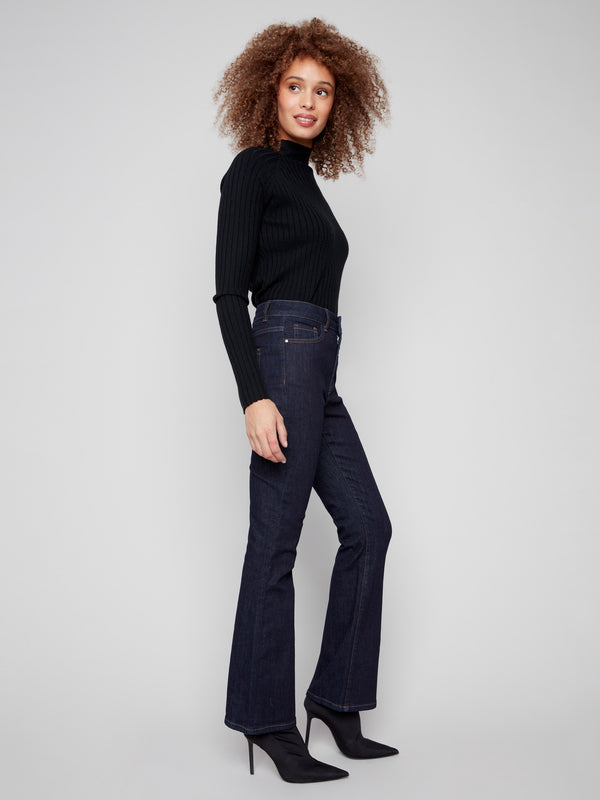 Chic bootcut fit in deep blue denim, ideal for pairing with heels or boots by Charlie B.