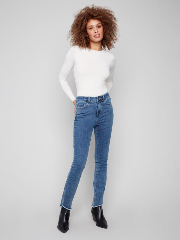 Medium blue bootcut jeans featuring a long length and stylish design by Charlie B.