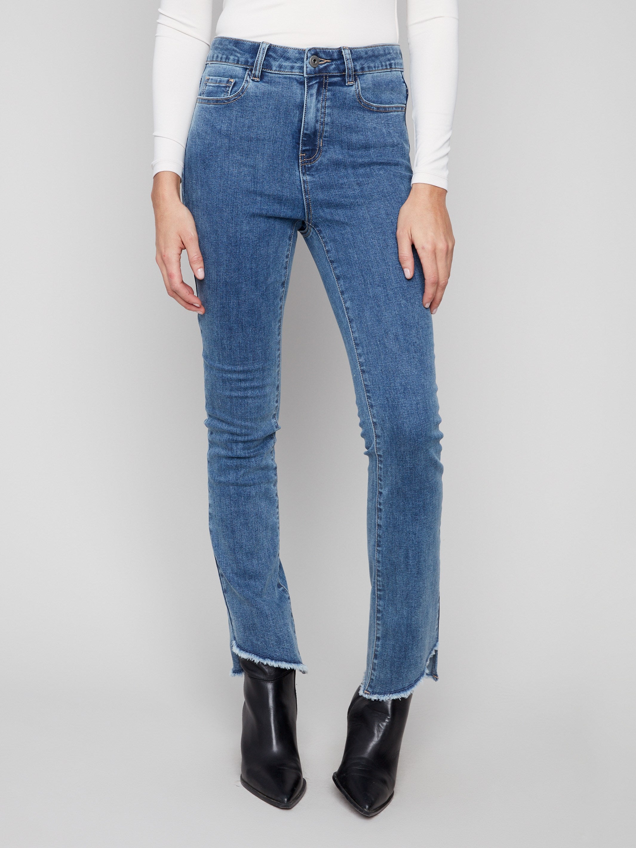 Stretch denim jeans in medium blue with a chic five-pocket style by Charlie B.