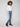 Blue bootcut jeans showcasing an asymmetrical fringed hem for flair by Charlie B.