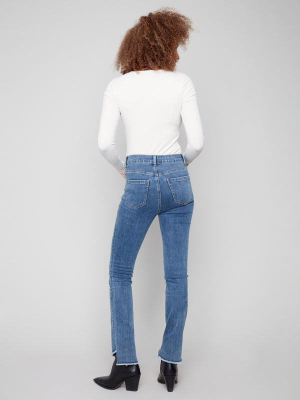 Five-pocket design on these medium blue stretch denim jeans by Charlie B.