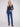Experience the flattering long length of these indigo bootcut jeans with stretch fabric by Charlie B.
