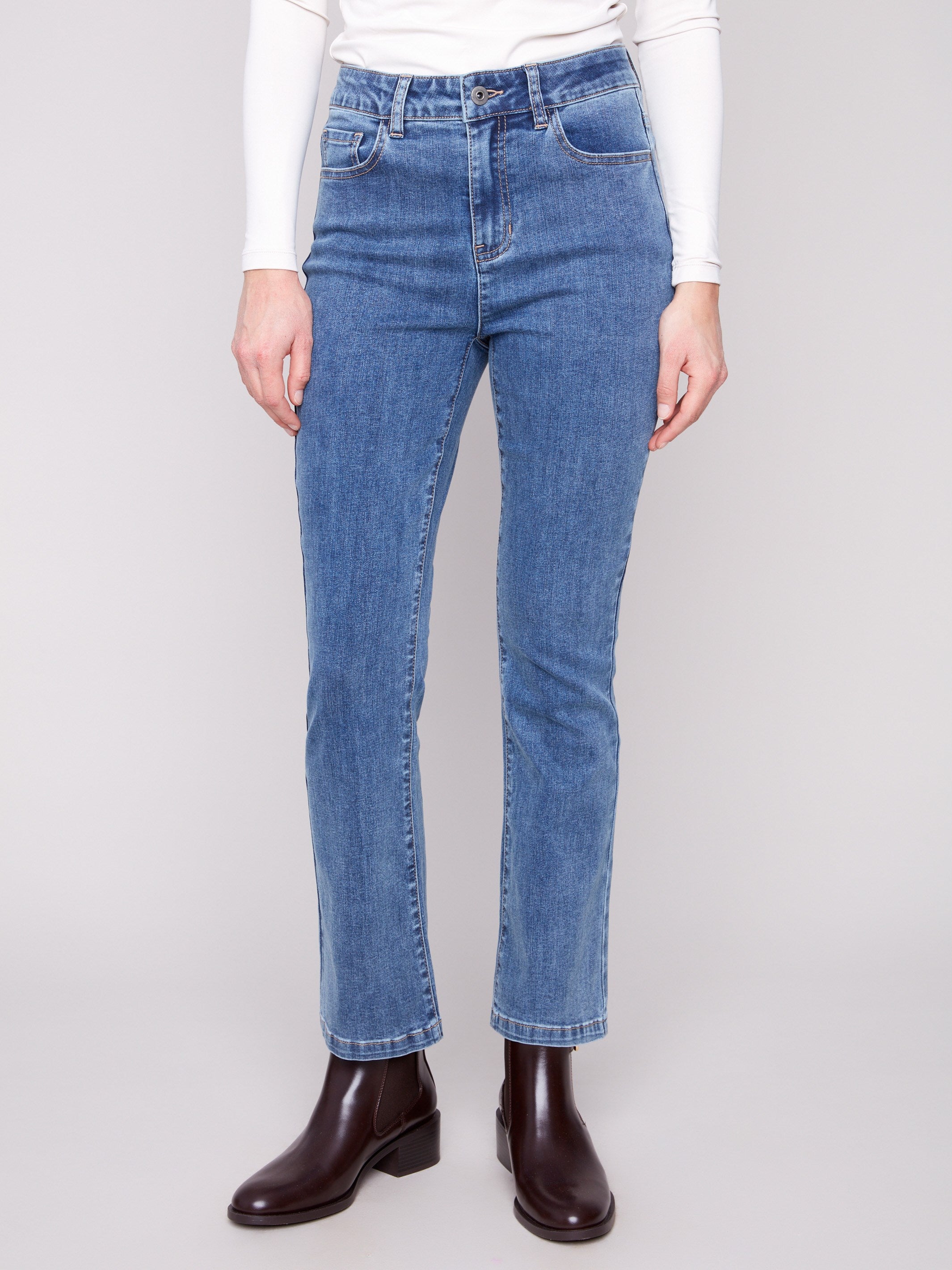These jeans showcase a mid-rise waist for a flattering silhouette, perfect for everyday wear by Charlie B.