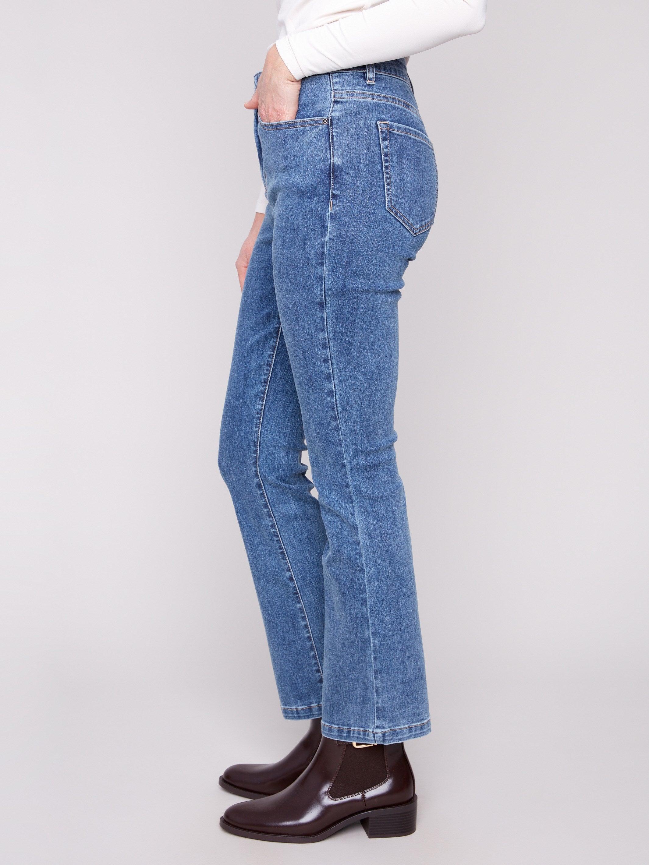 Classic five-pocket design enhances the versatile look of these stylish medium blue pants by Charlie B.