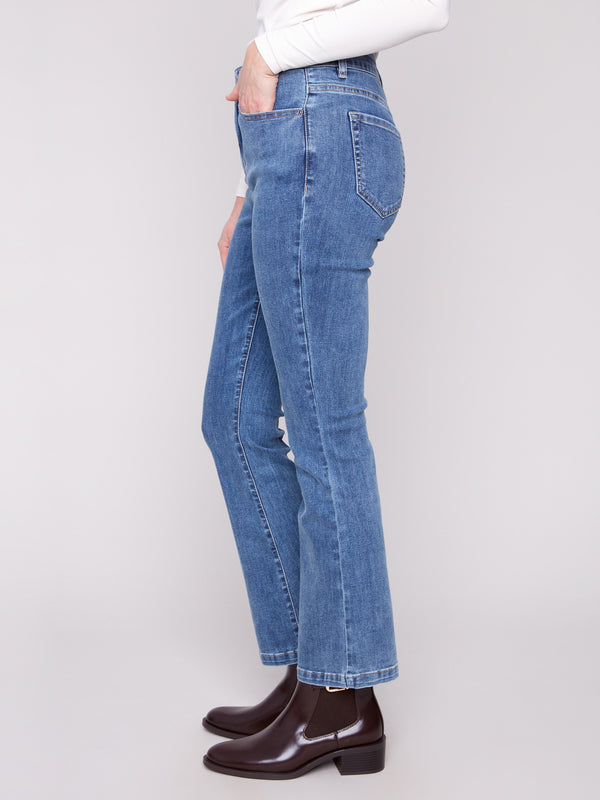 Classic five-pocket design enhances the versatile look of these stylish medium blue pants by Charlie B.