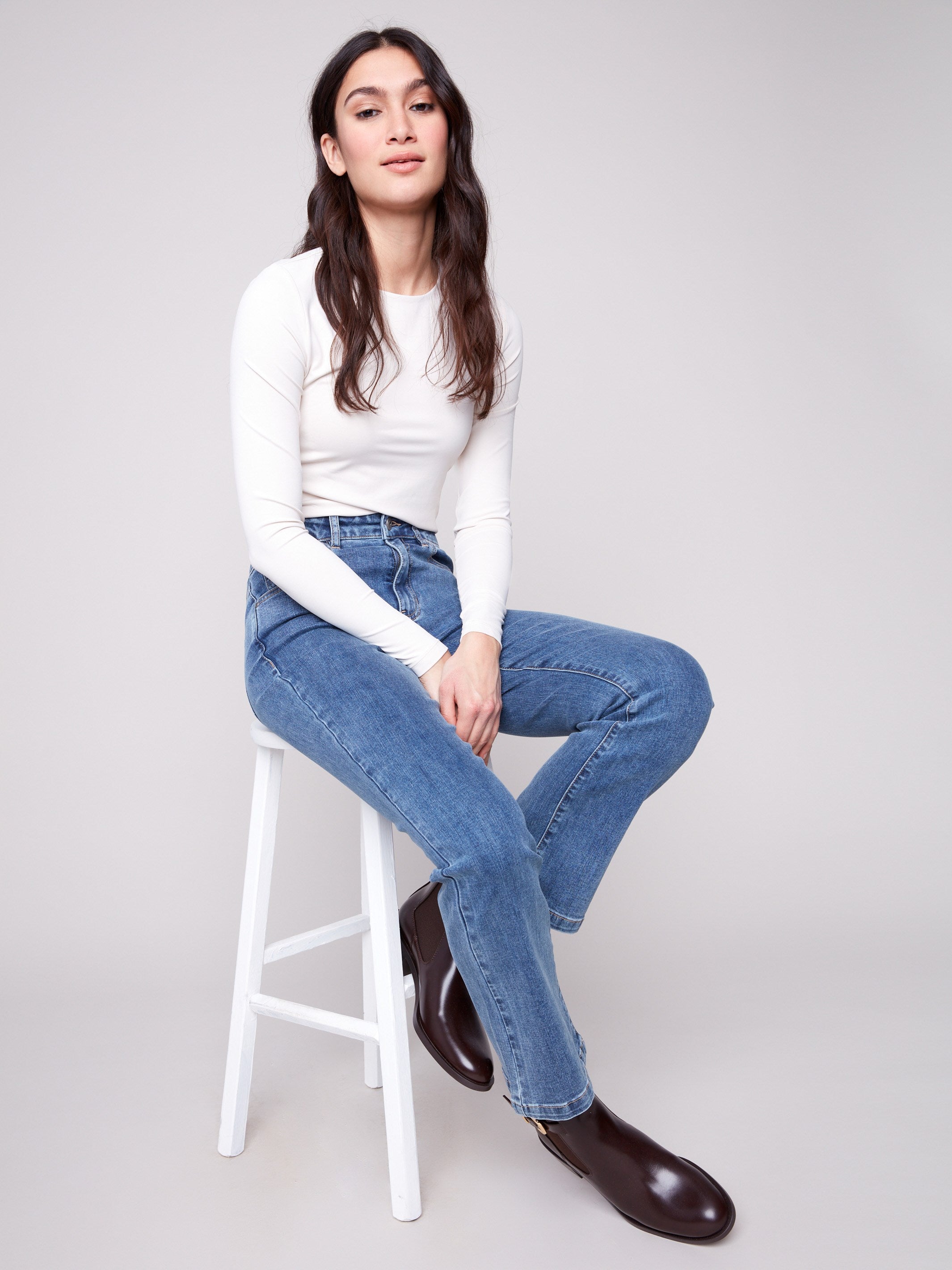 Crafted from stretch denim, these bootcut jeans provide ease of movement and modern appeal by Charlie B.