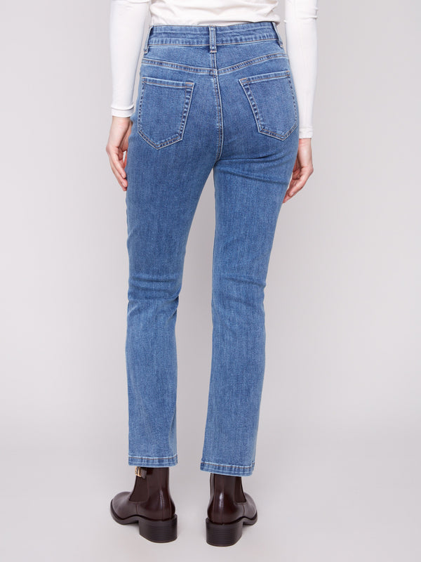 Embrace the mid-rise waistline in these comfortable and chic medium blue denim pants by Charlie B.