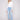 Light blue denim pants by Charlie B featuring a bootcut fit and stylish stretch fabric for comfort and flexibility.