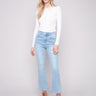 Light blue denim pants by Charlie B featuring a bootcut fit and stylish stretch fabric for comfort and flexibility.