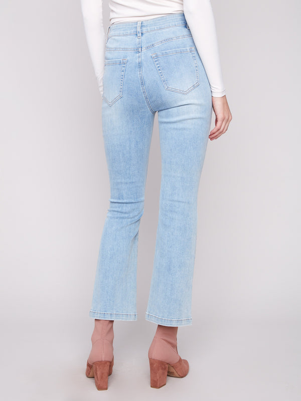 Stylish bootcut jeans in light blue by Charlie B with a mid-rise waist, combining fashion with function effortlessly.