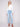 Light blue bootcut denim pants by Charlie B with a classic five-pocket design and regular rise.